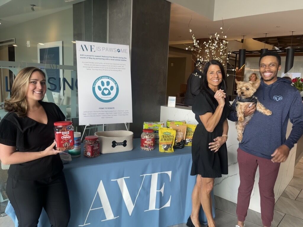 a group of people at AVE King of Prussia collecting pet supplies to donate