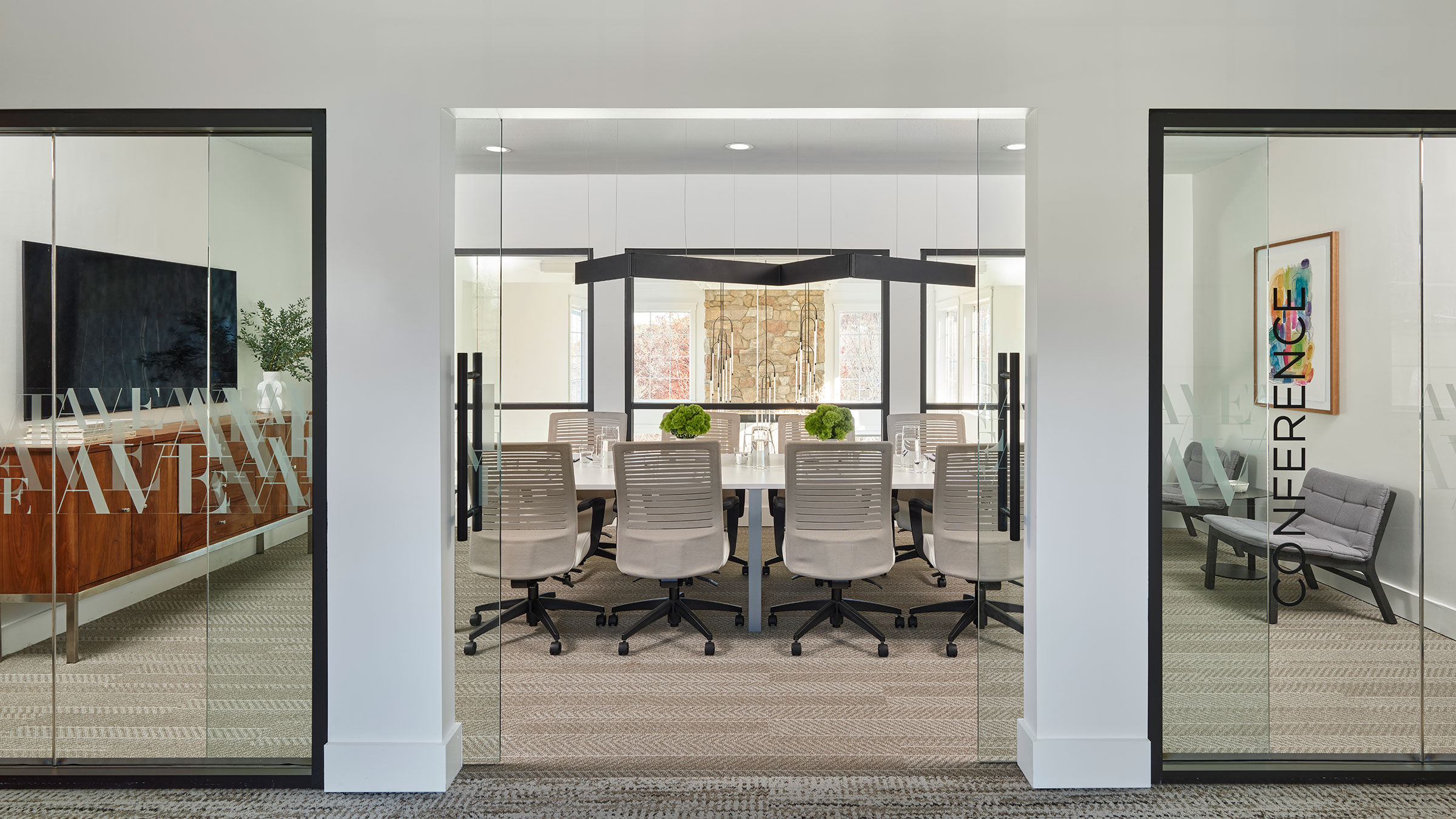 a conference room with a table and chairs