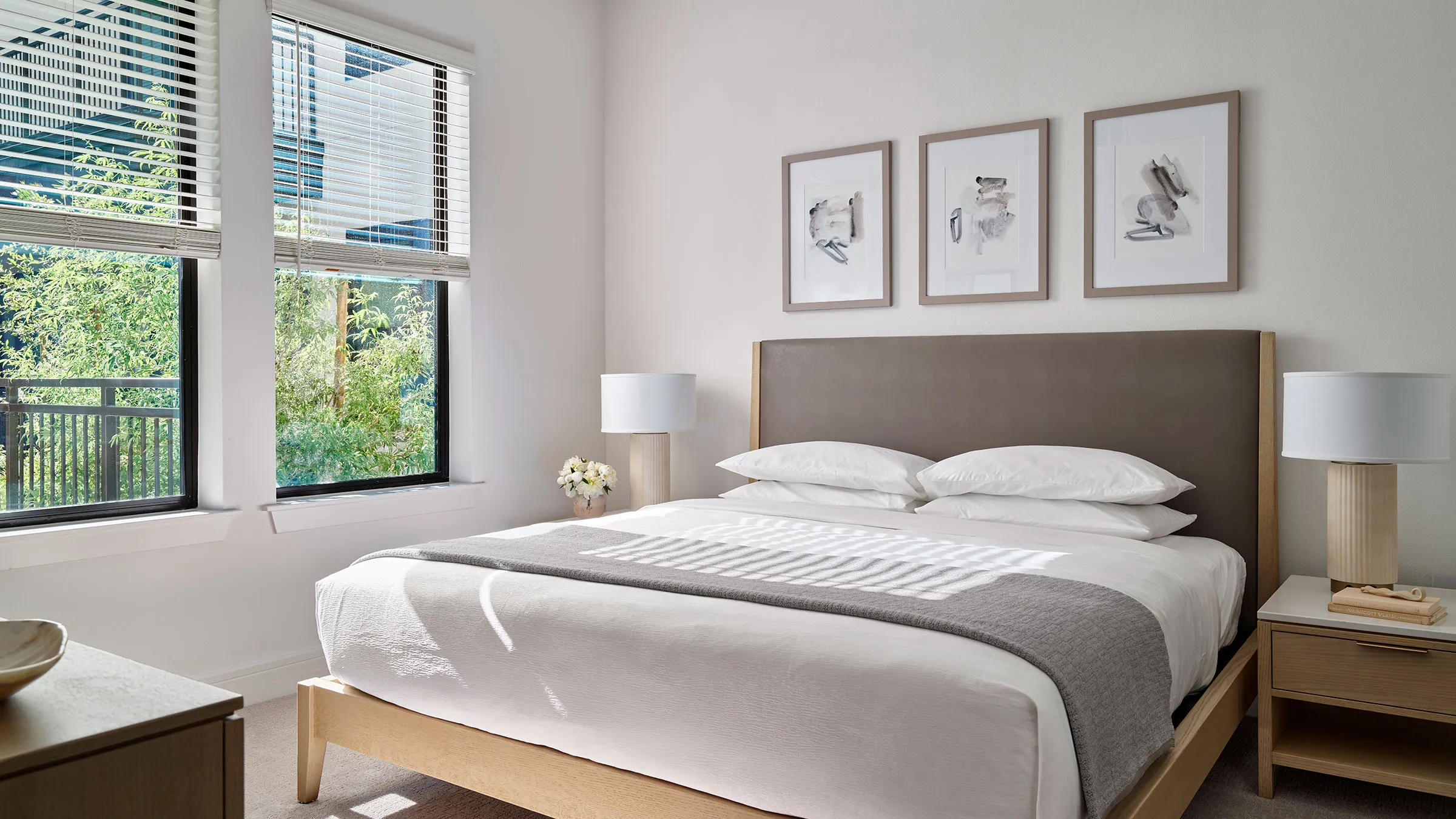 a bed with a lamp and a window