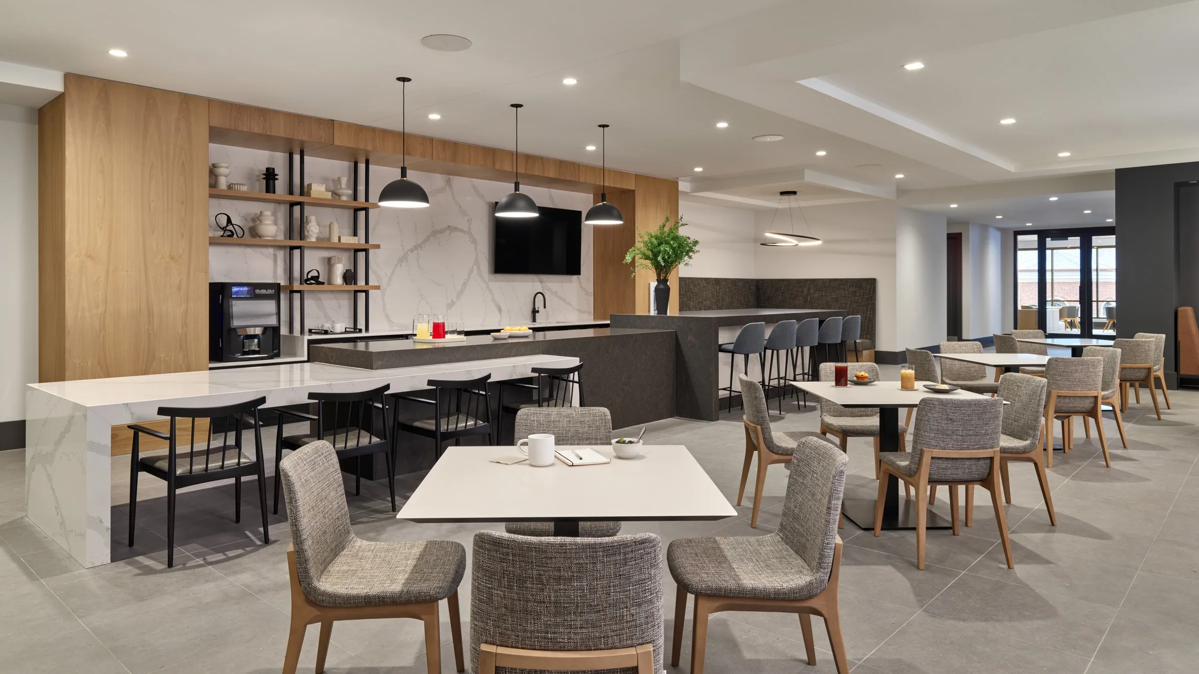 a room with a kitchen and dining area