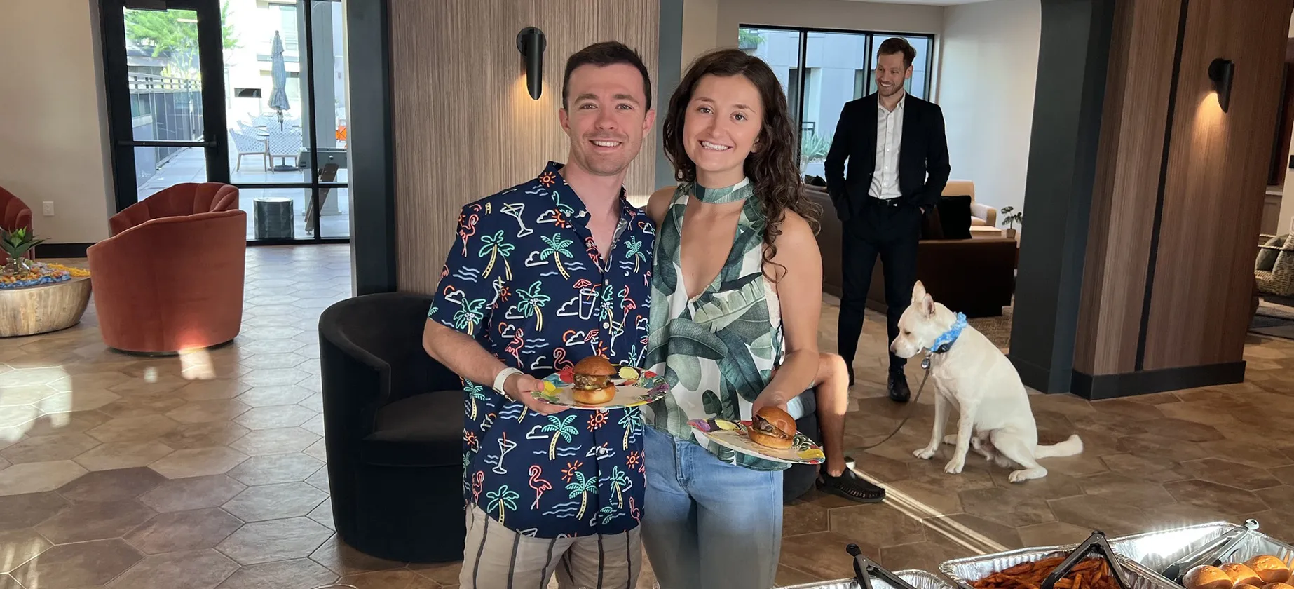 a man and woman holding plates of food
