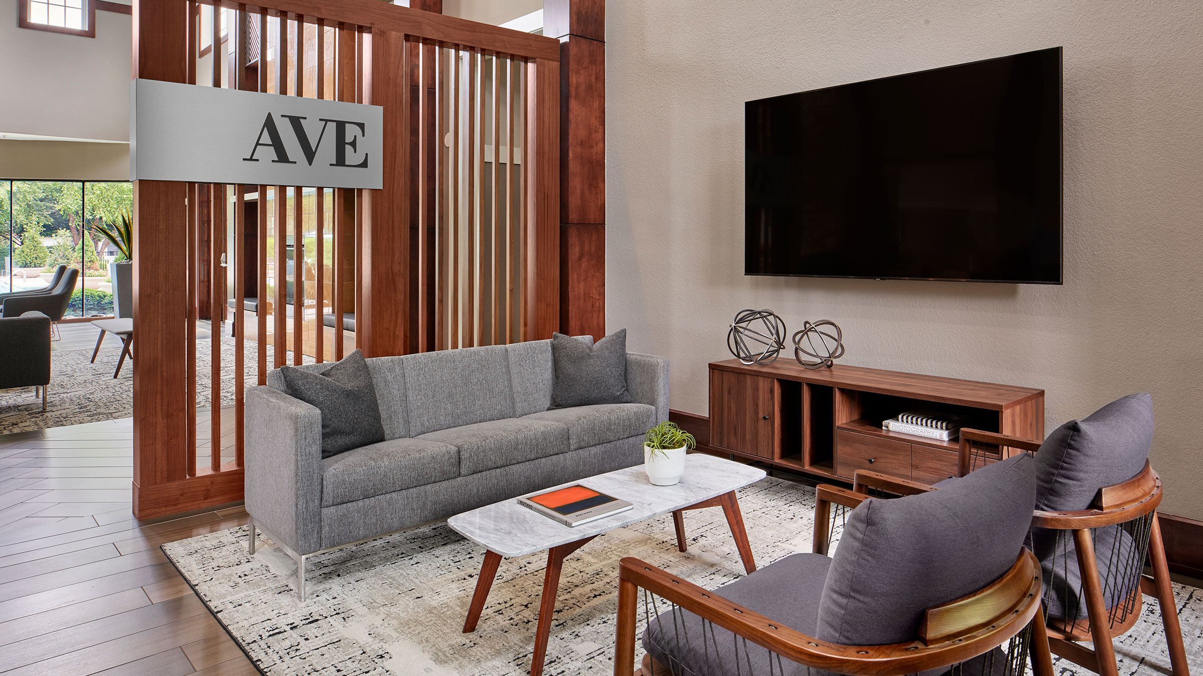 a living room with a tv on the wall
