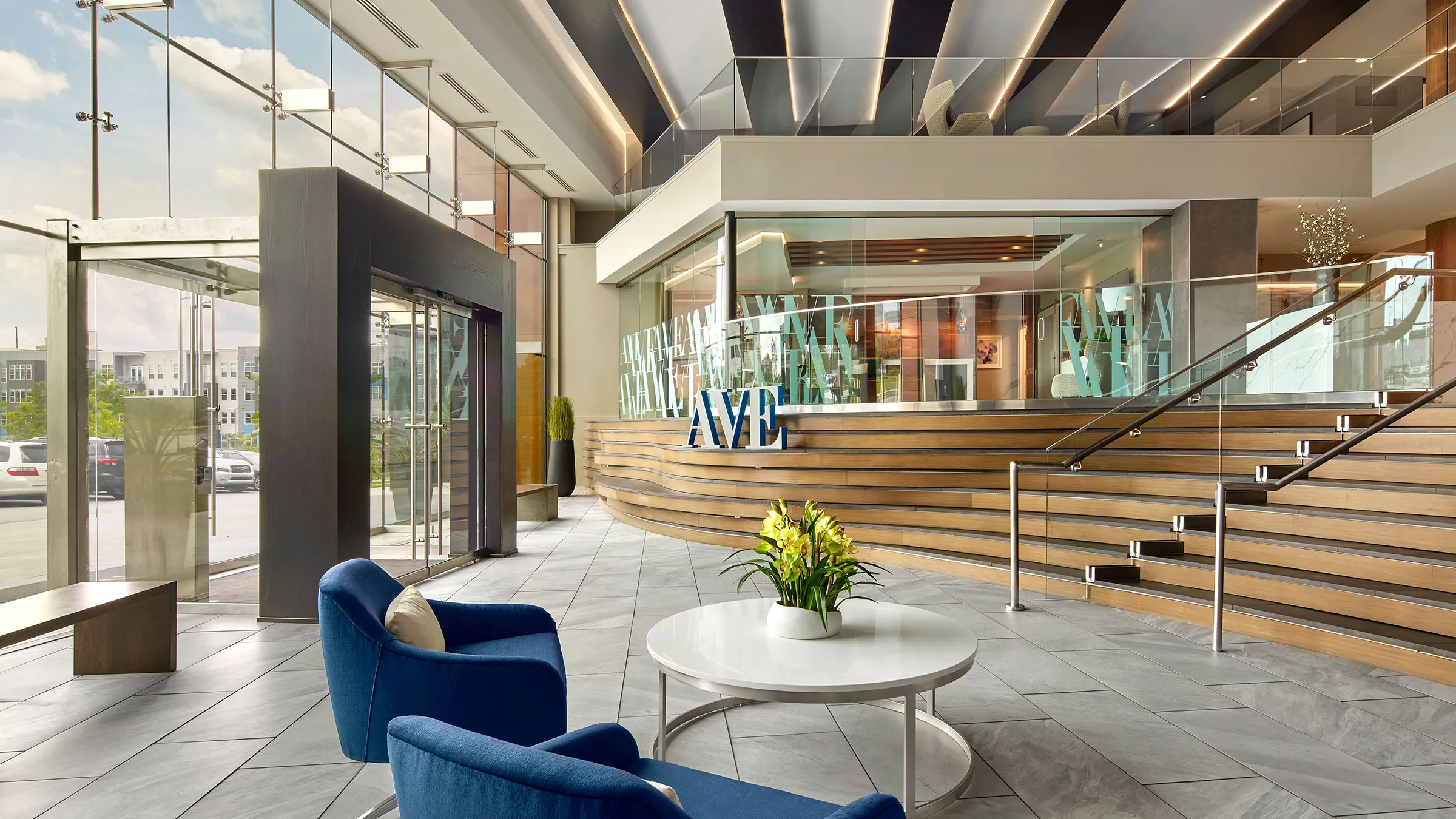 a lobby with a round table and chairs