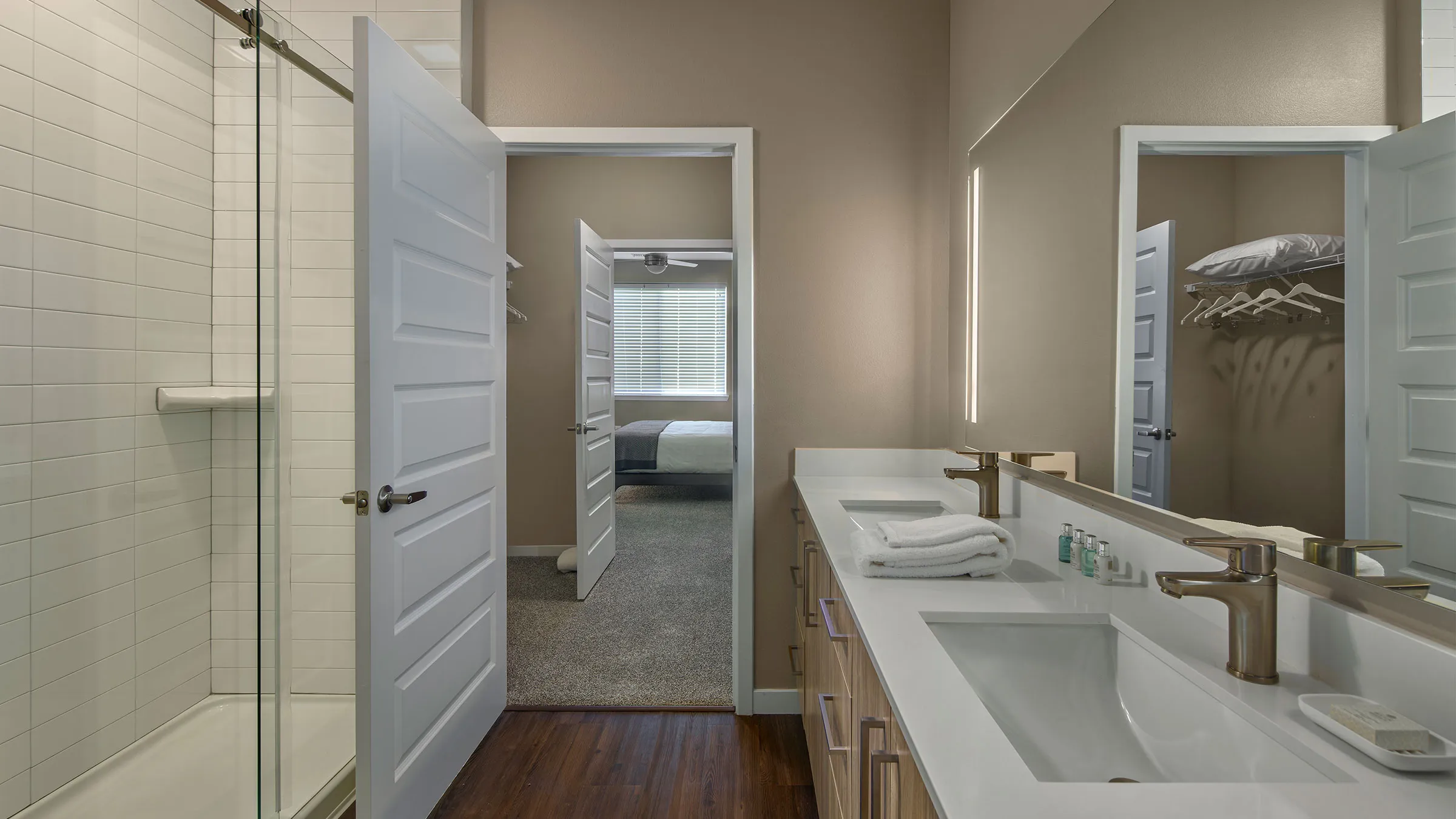 a bathroom with a double sink and a mirror