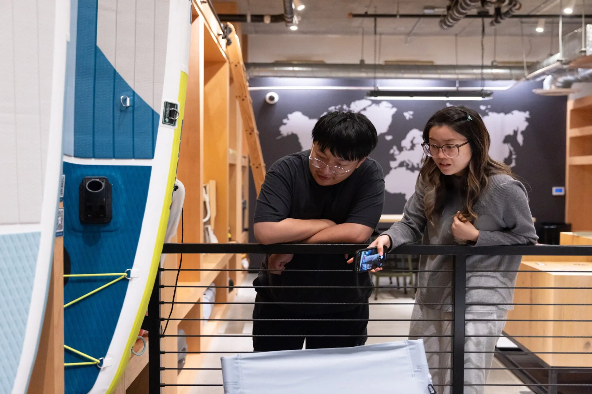 Two people looking at the AVE Santa Clara AVEnture Hub Amenity