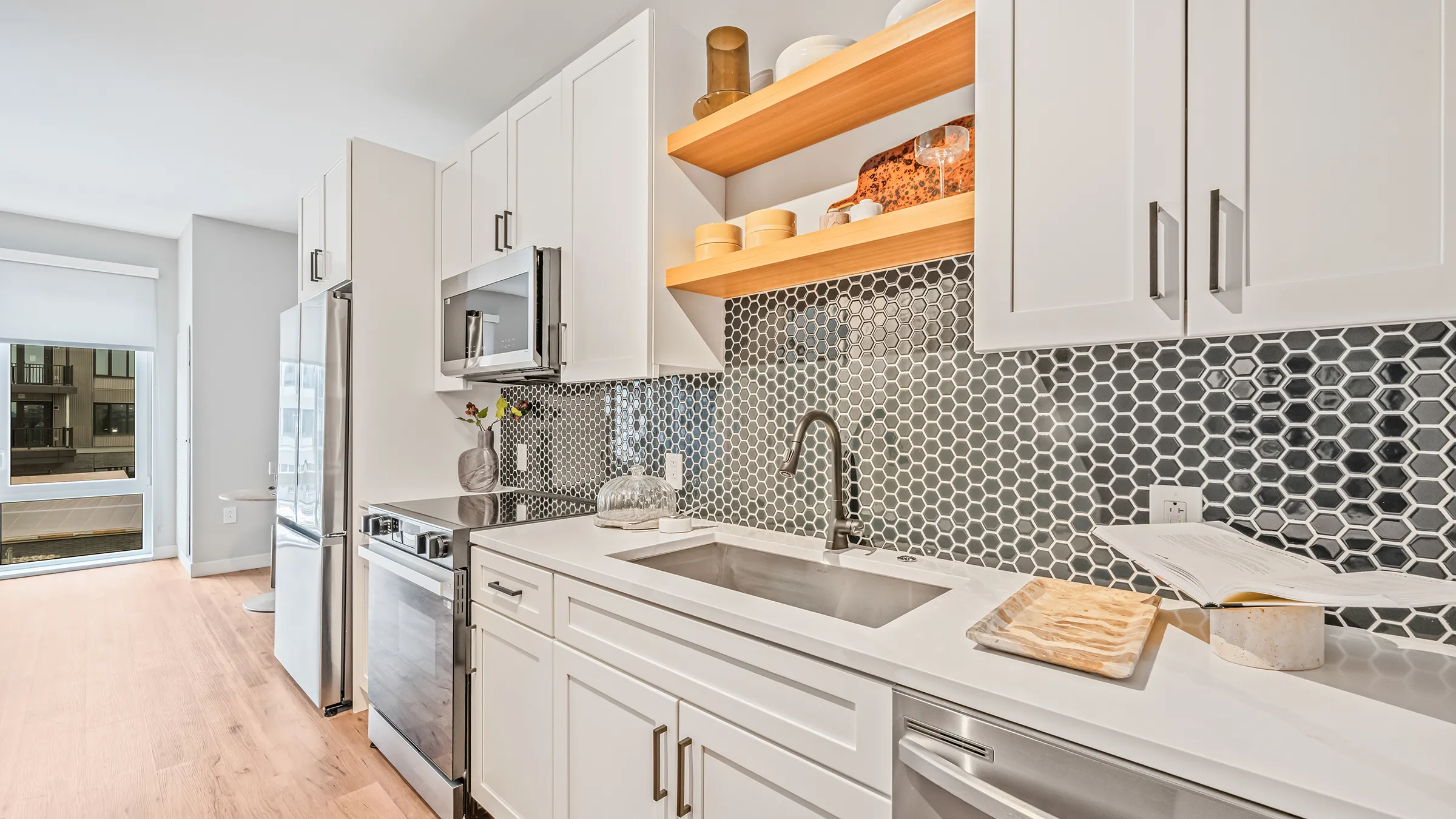 a kitchen with white cabinets and a sink
