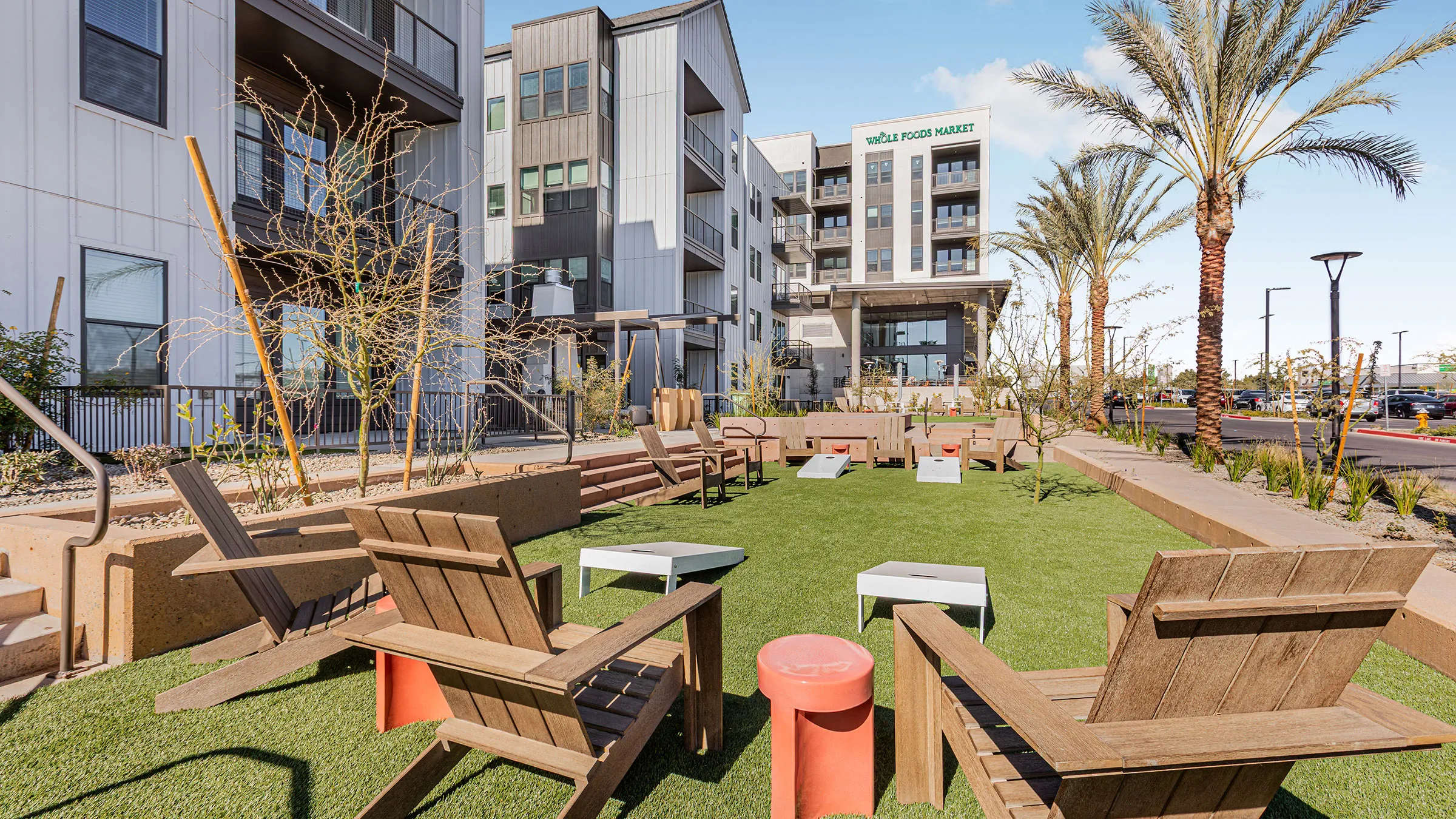 a group of chairs and tables in a courtyard