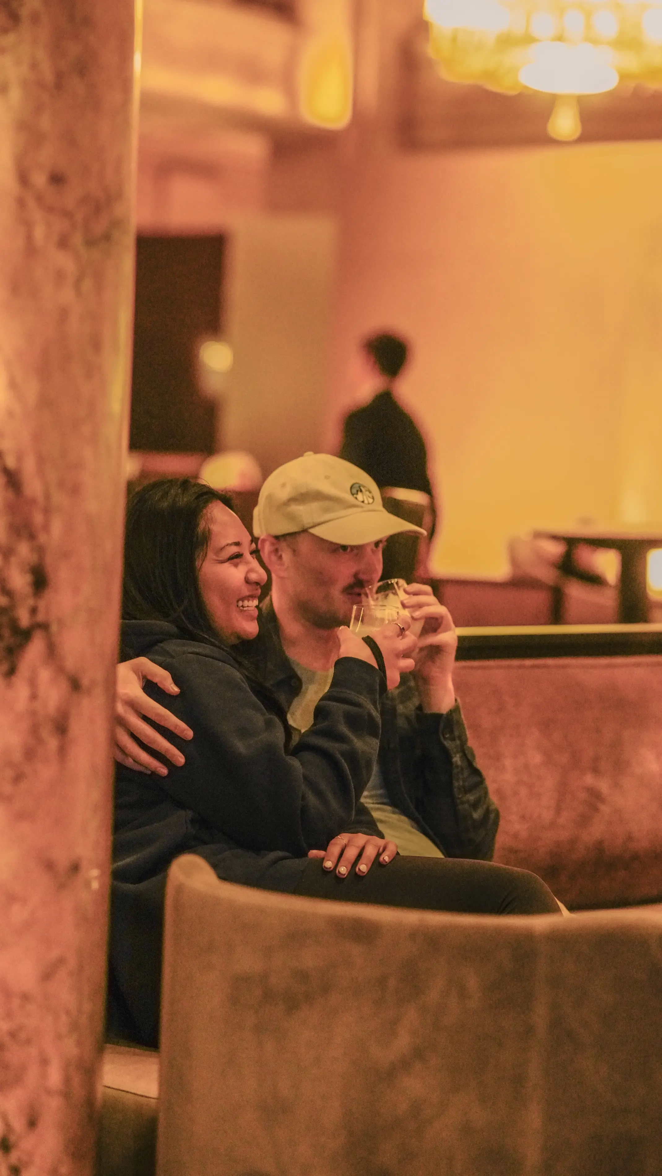 a man and woman sitting on a couch