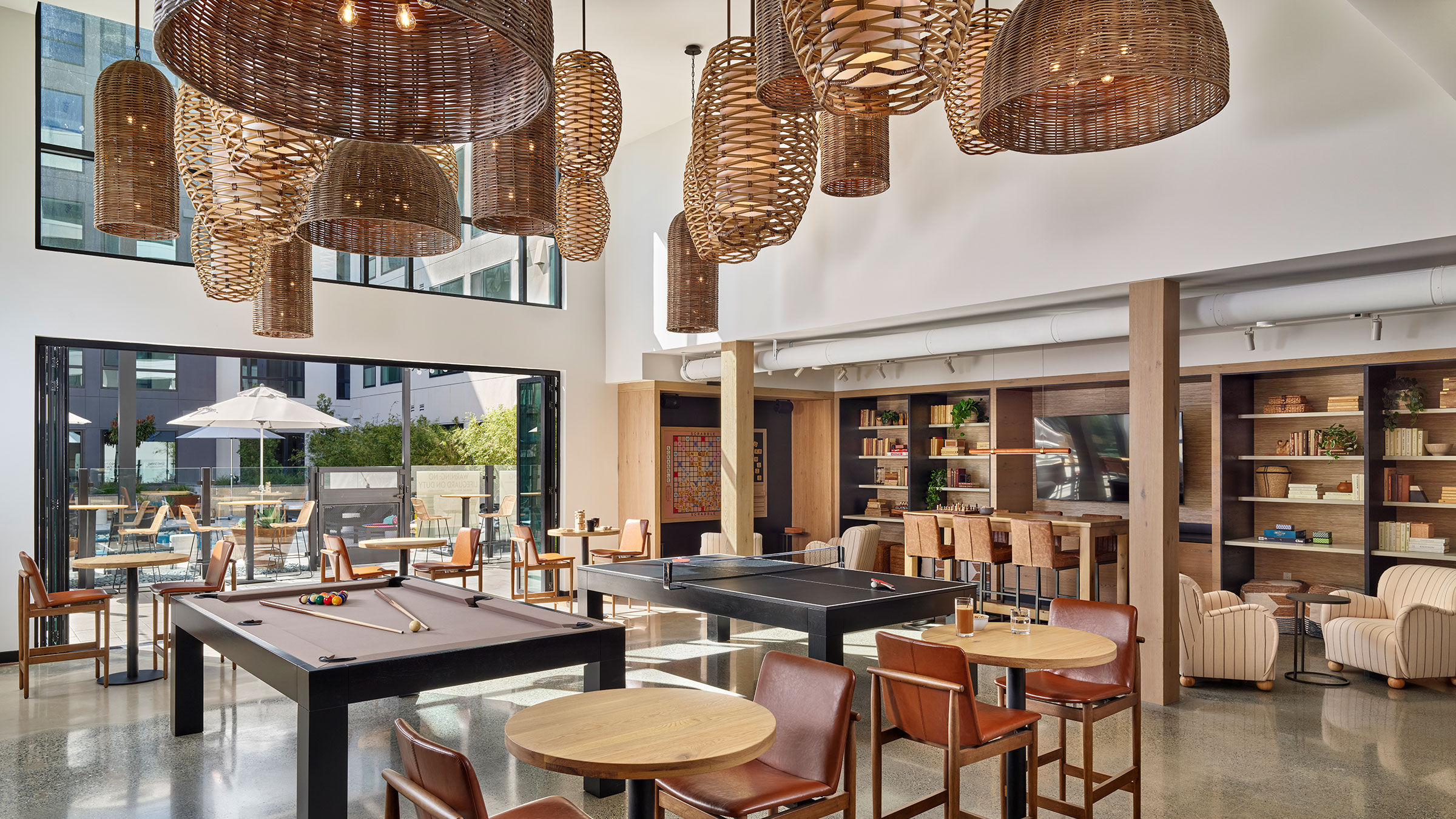 a pool table and chairs in a room