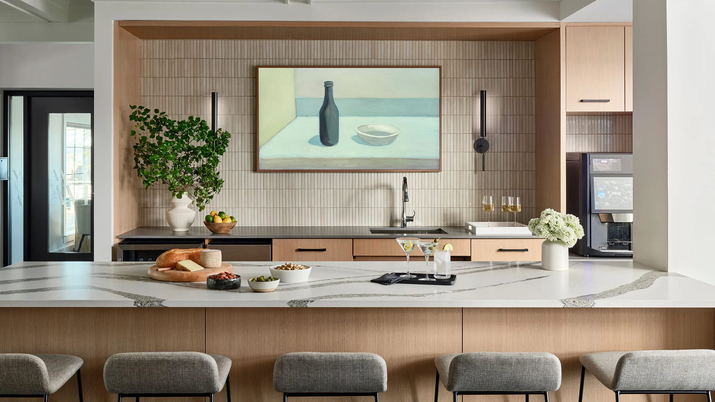 a kitchen with a large countertop and a painting on the wall