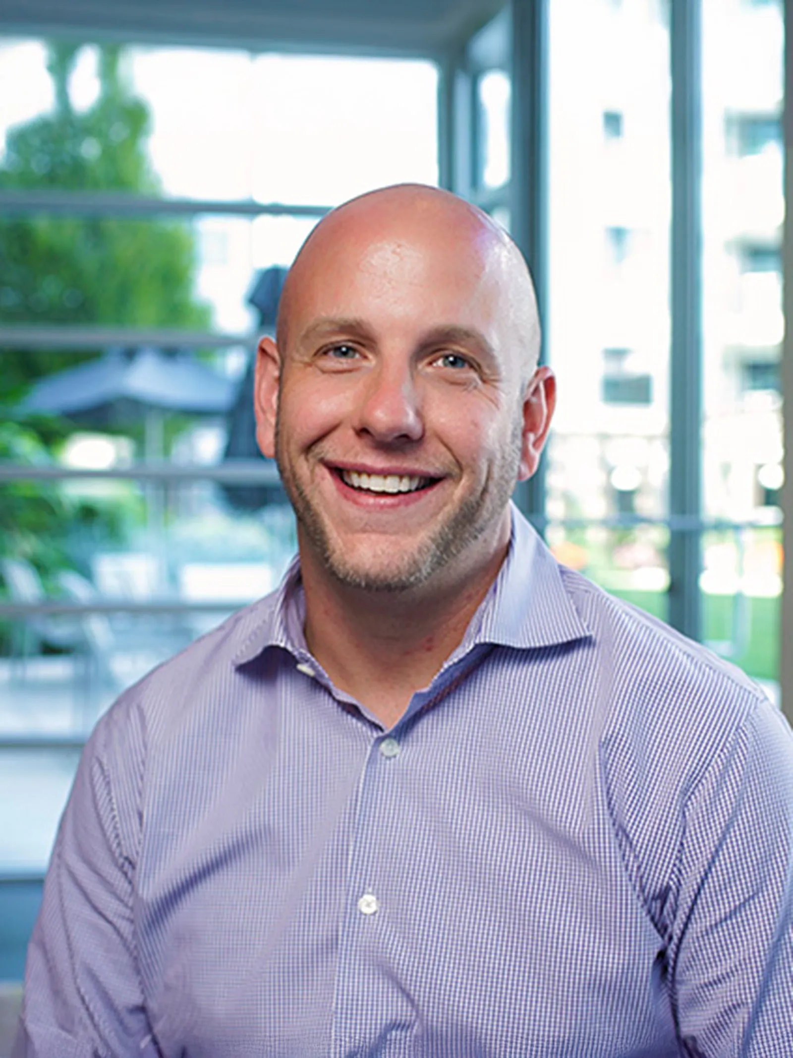 a man smiling at the camera