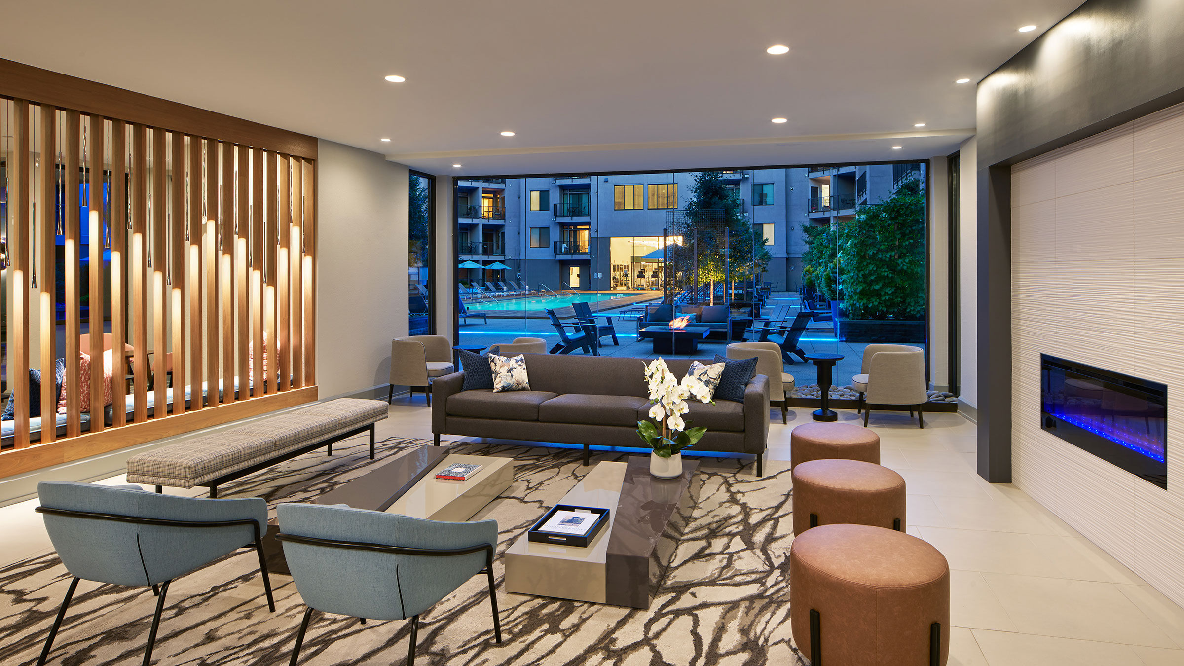 a room with a couch and chairs