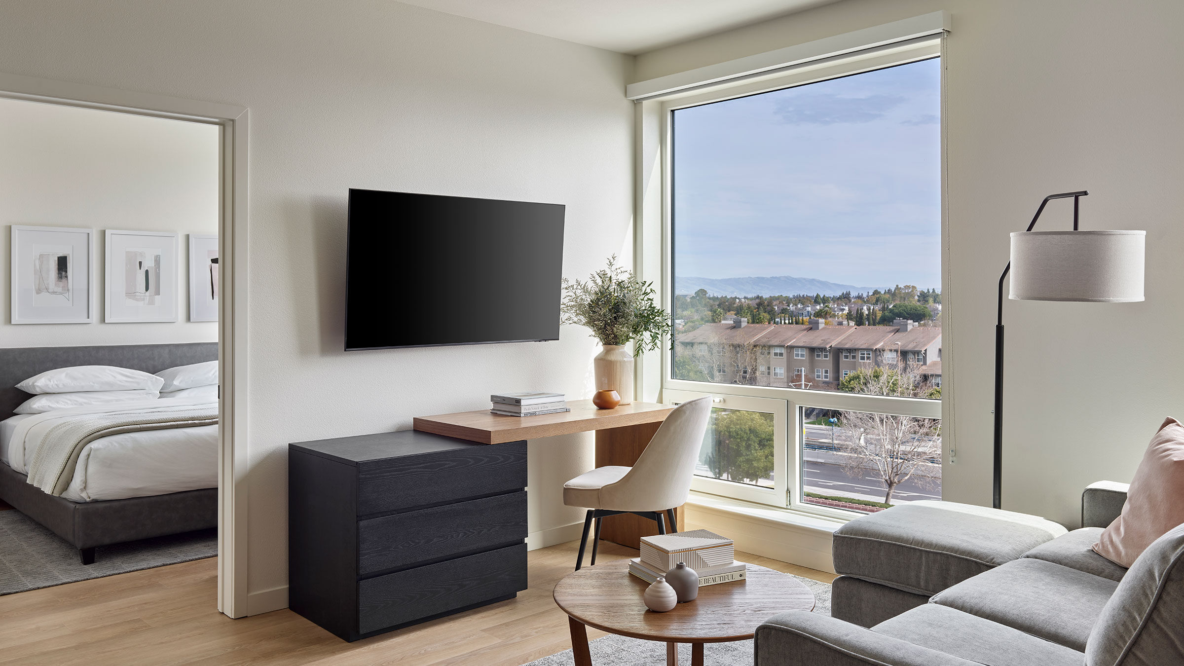 a living room with a tv on the wall