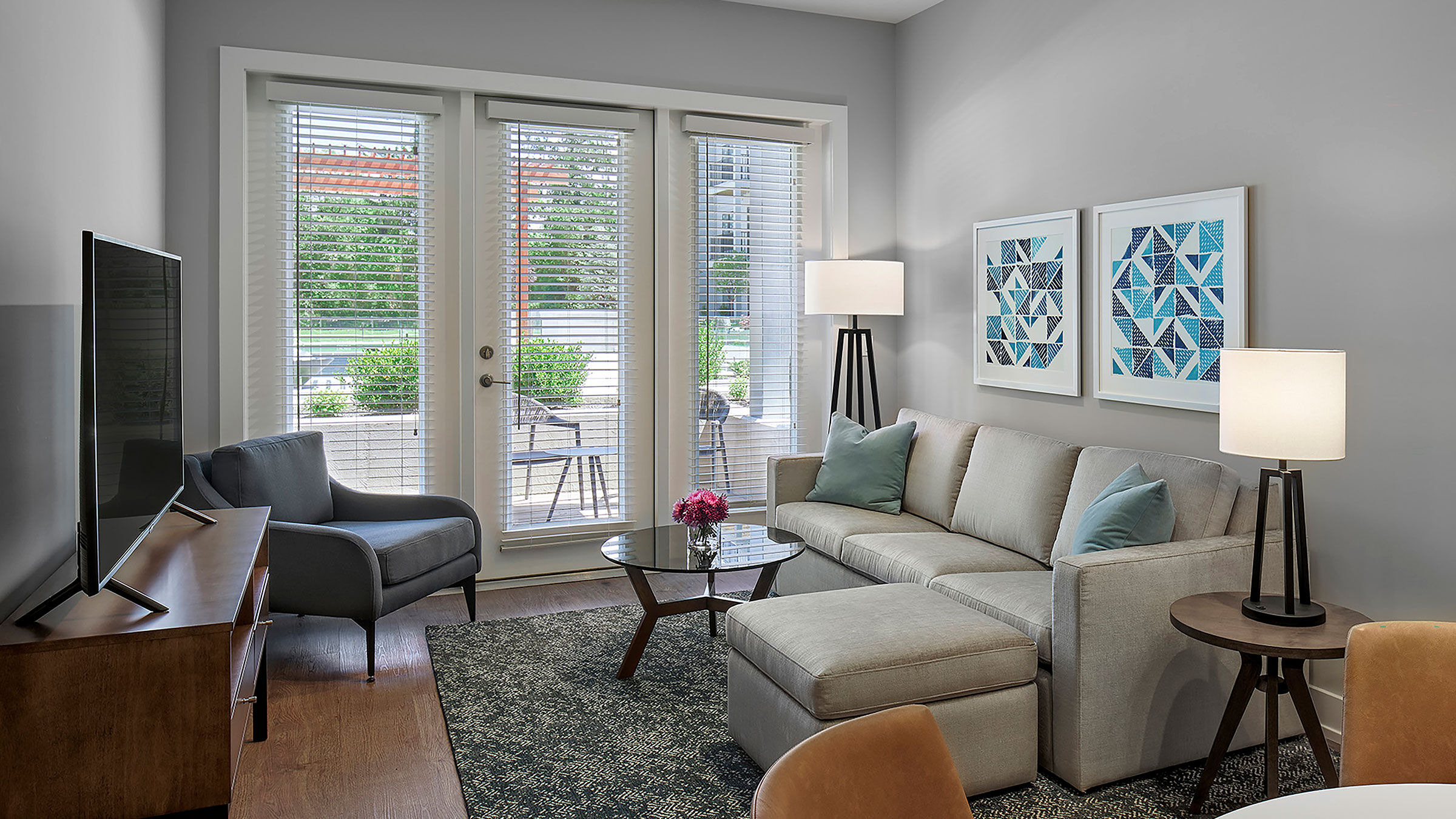a living room with a couch and chairs