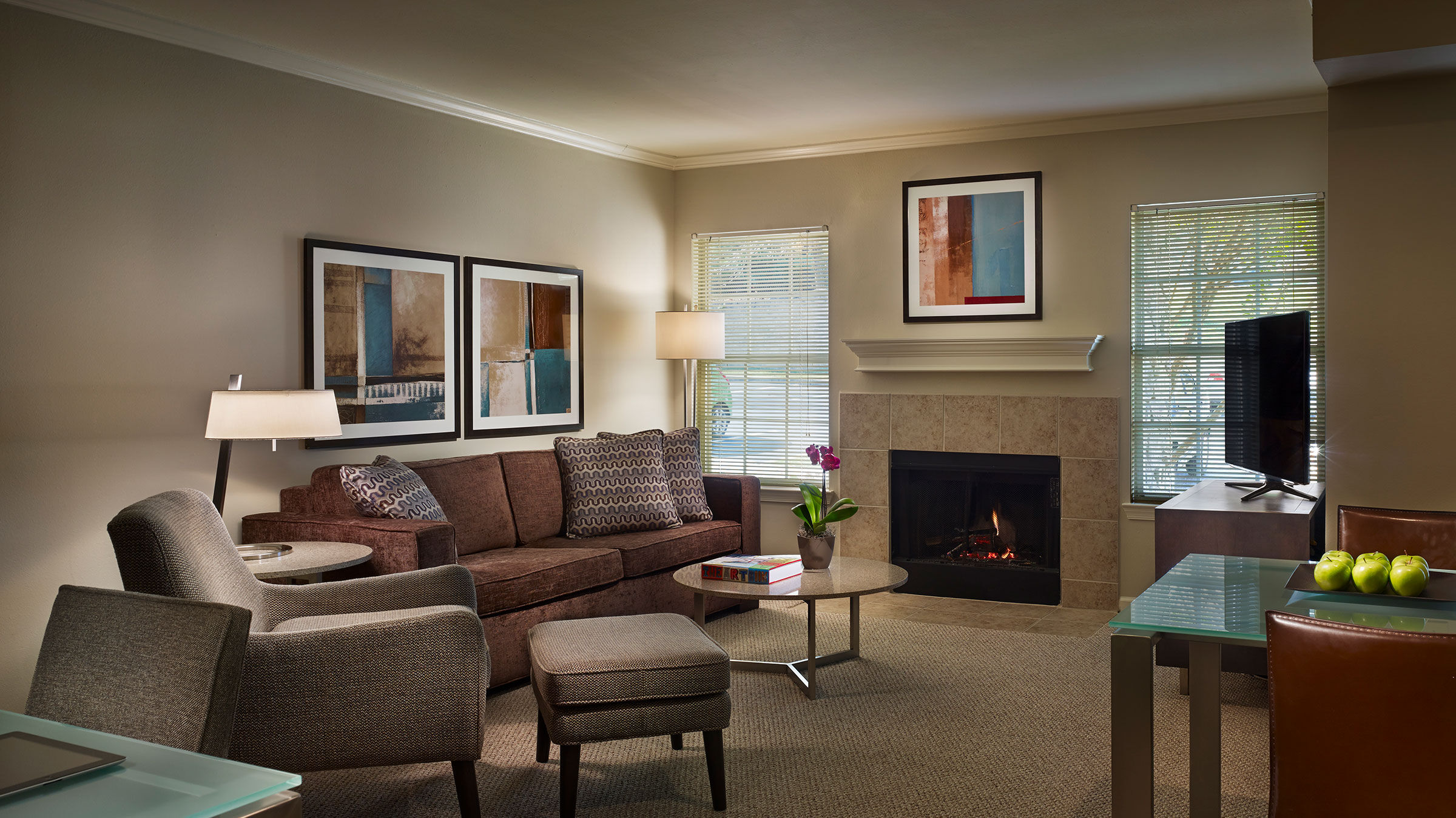 a living room with a fireplace and a couch
