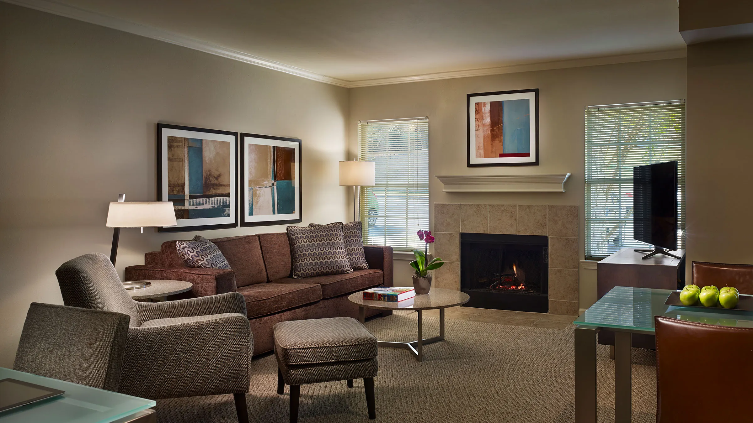 a living room with a fireplace and a couch