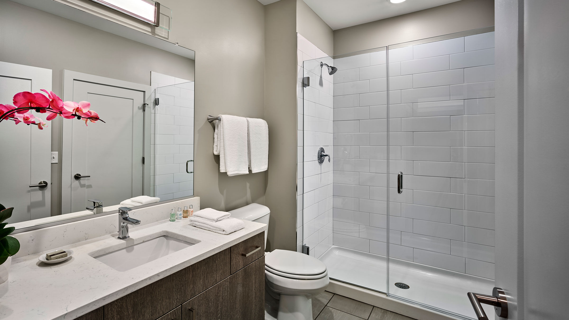 a bathroom with a shower and sink
