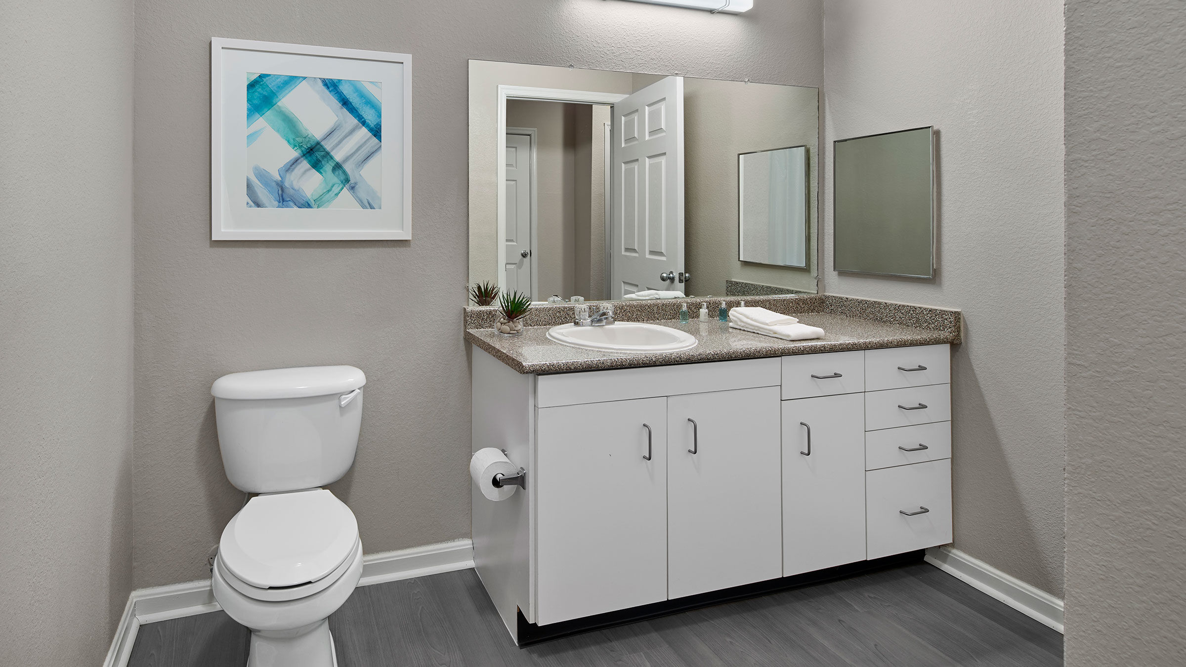 a bathroom with a mirror and sink