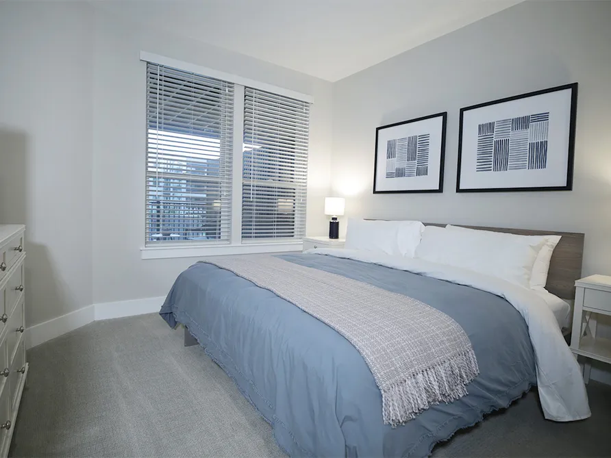 a bed in an apartment bedroom