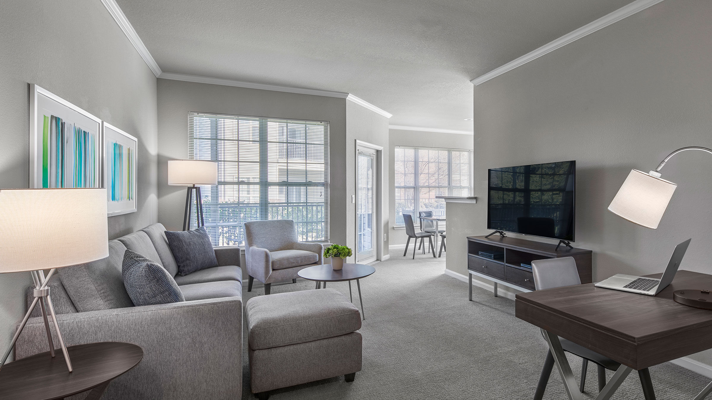 a living room with a television and couches