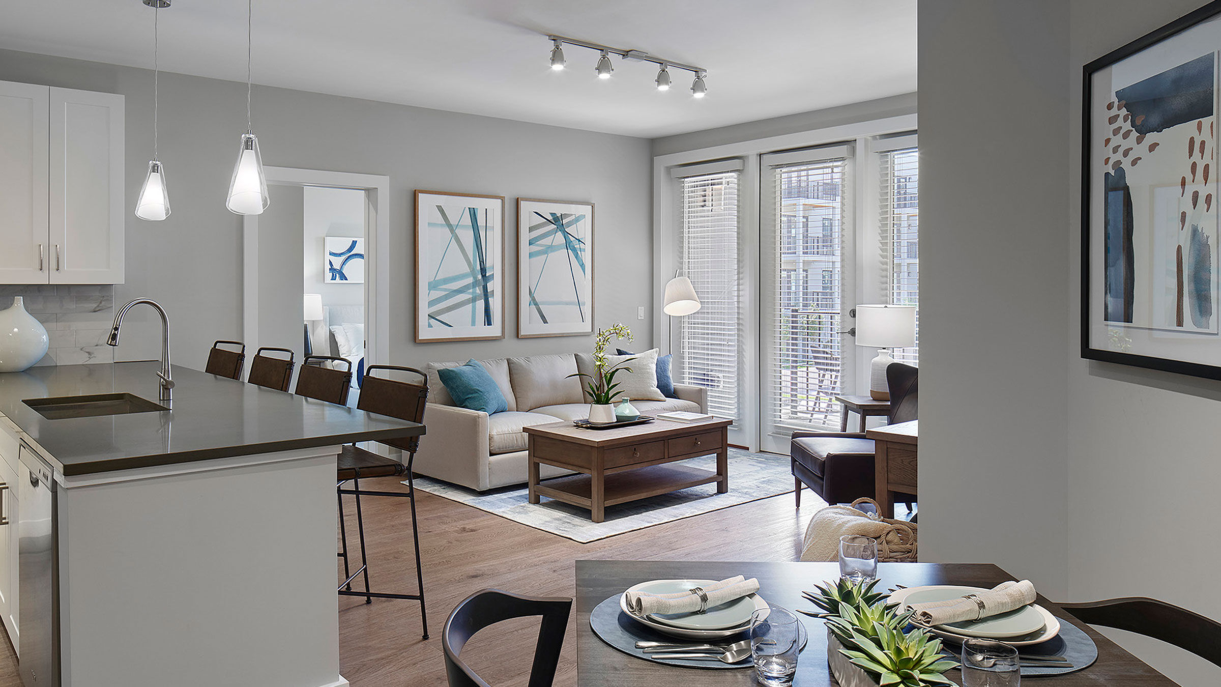 a living room with a couch and dining table