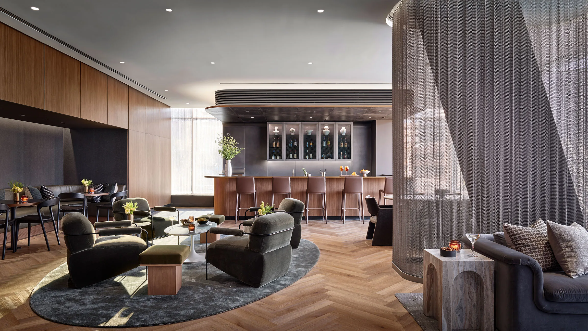 a room with a bar and chairs