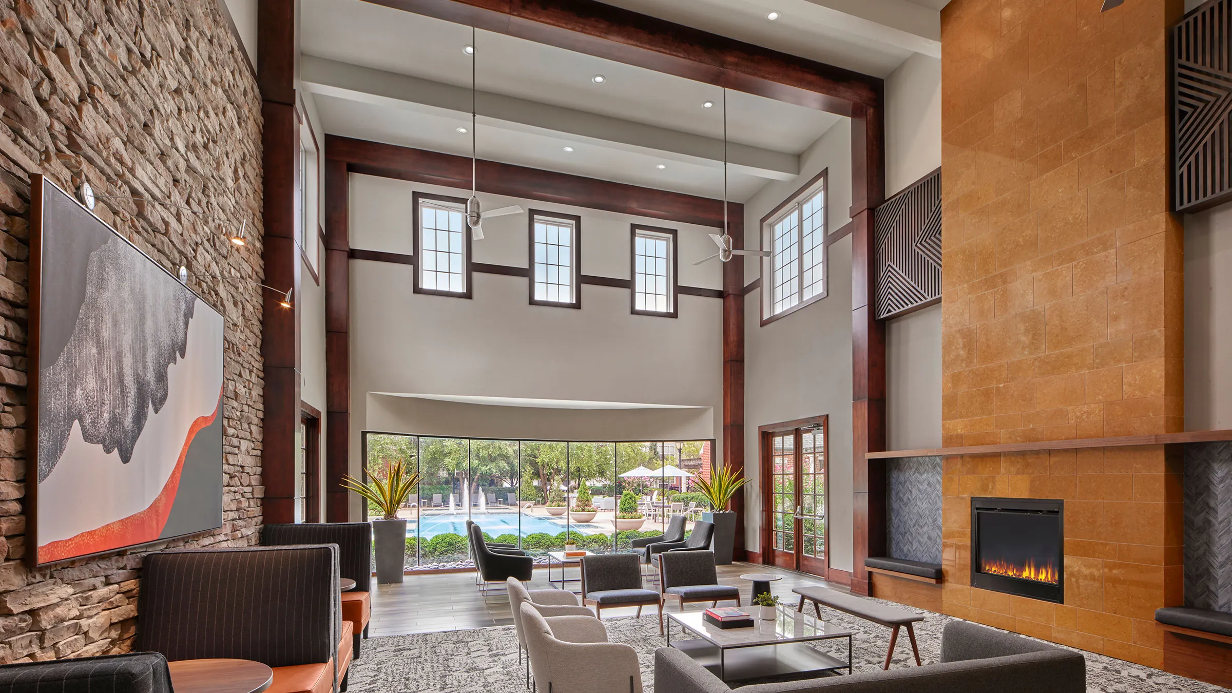 a room with a fireplace and a pool