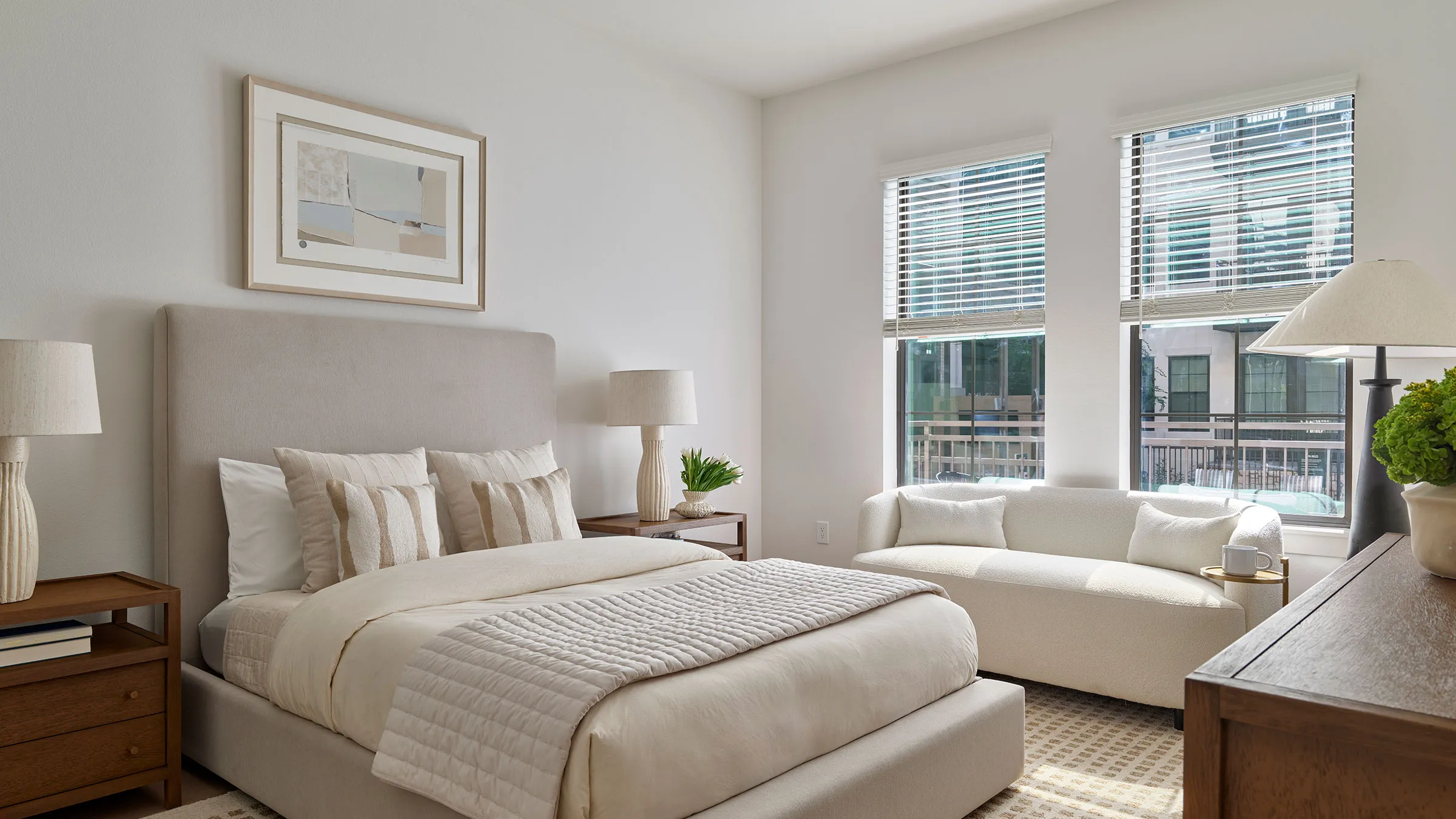 a bedroom with a bed and a couch