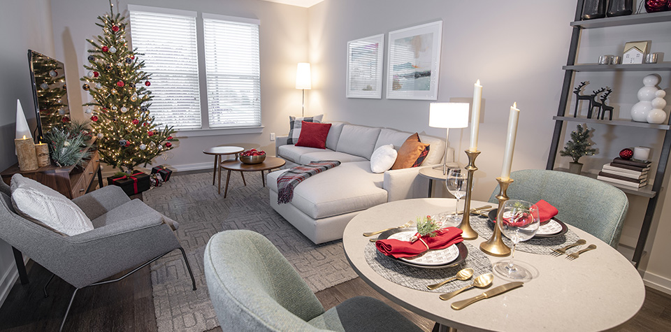 living room decorated with dining table and Christmas tree