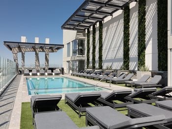rooftop terrace with ample outdoor seating and grilling stations