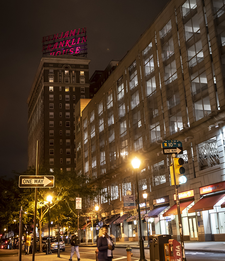 Ben Franklin House sign in pink light