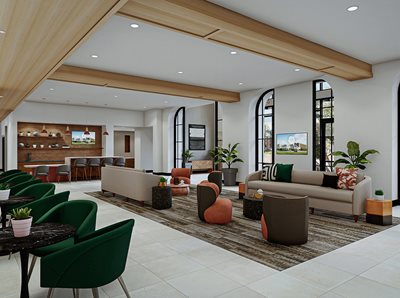 Lounge area with cream couches and green club chairs. Bar like area with high top seating, large windows with wood accents on ceiling and walls