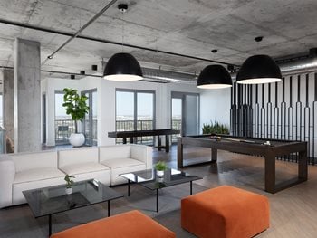 resident lounge with ample seating, cream couch for relaxation or bar for work from home area