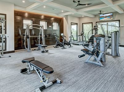 Fitness Center with free weights, benches and weight machinery