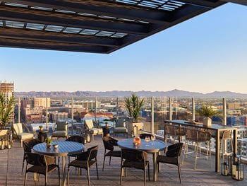 rooftop terrace with ample outdoor seating and grilling stations