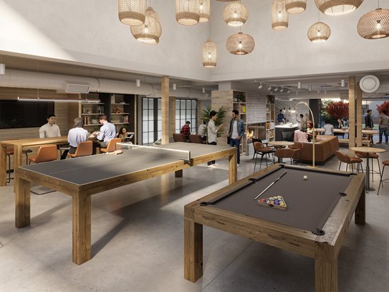 Lounge area with cream couches and green club chairs. Bar like area with high top seating, large win