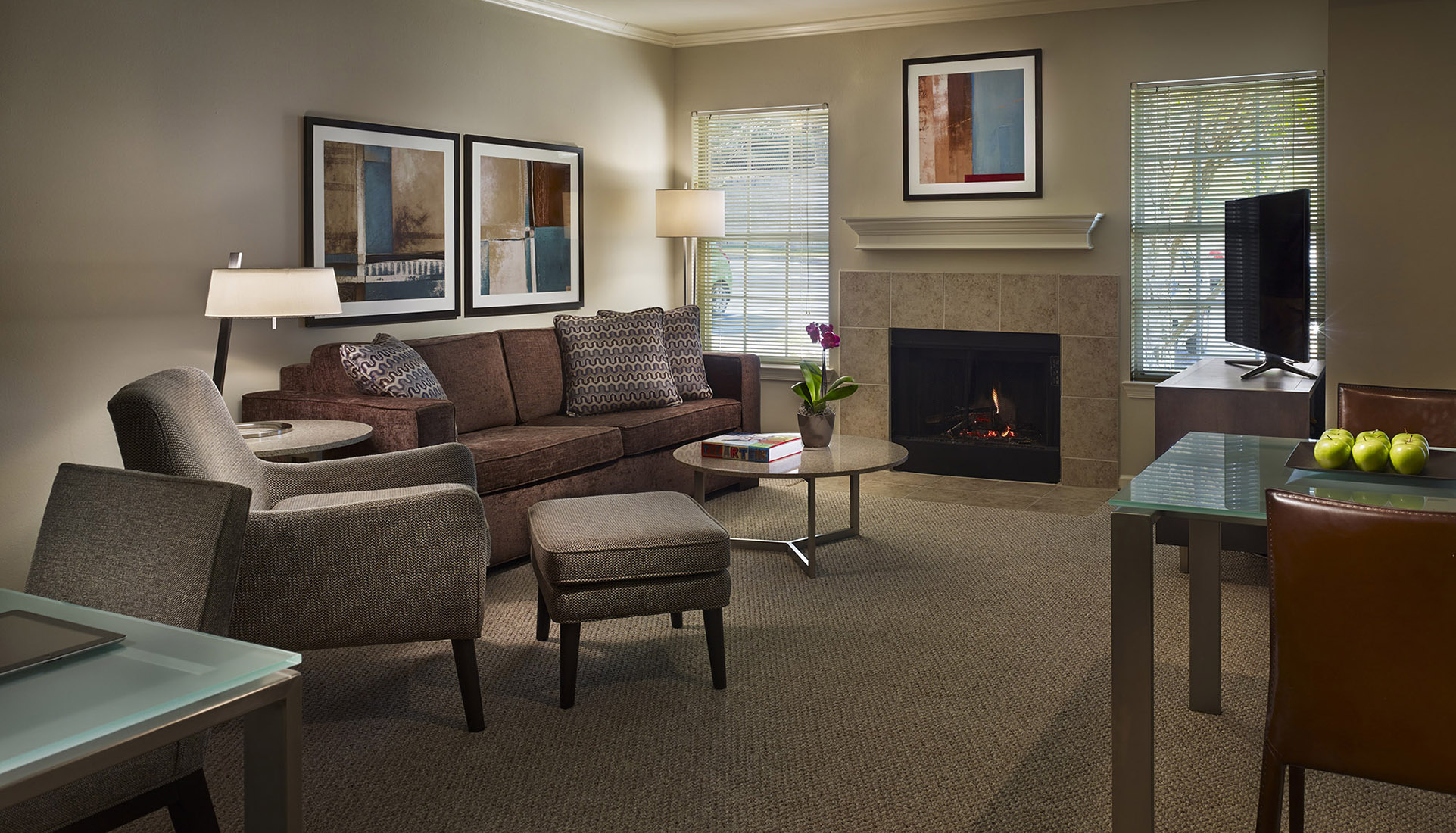 Furnished suite living room with a couch, and a tv