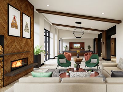 Fireplace Lounge with creame sofas, green and orange club chairs, wood accents on wall with firewood area